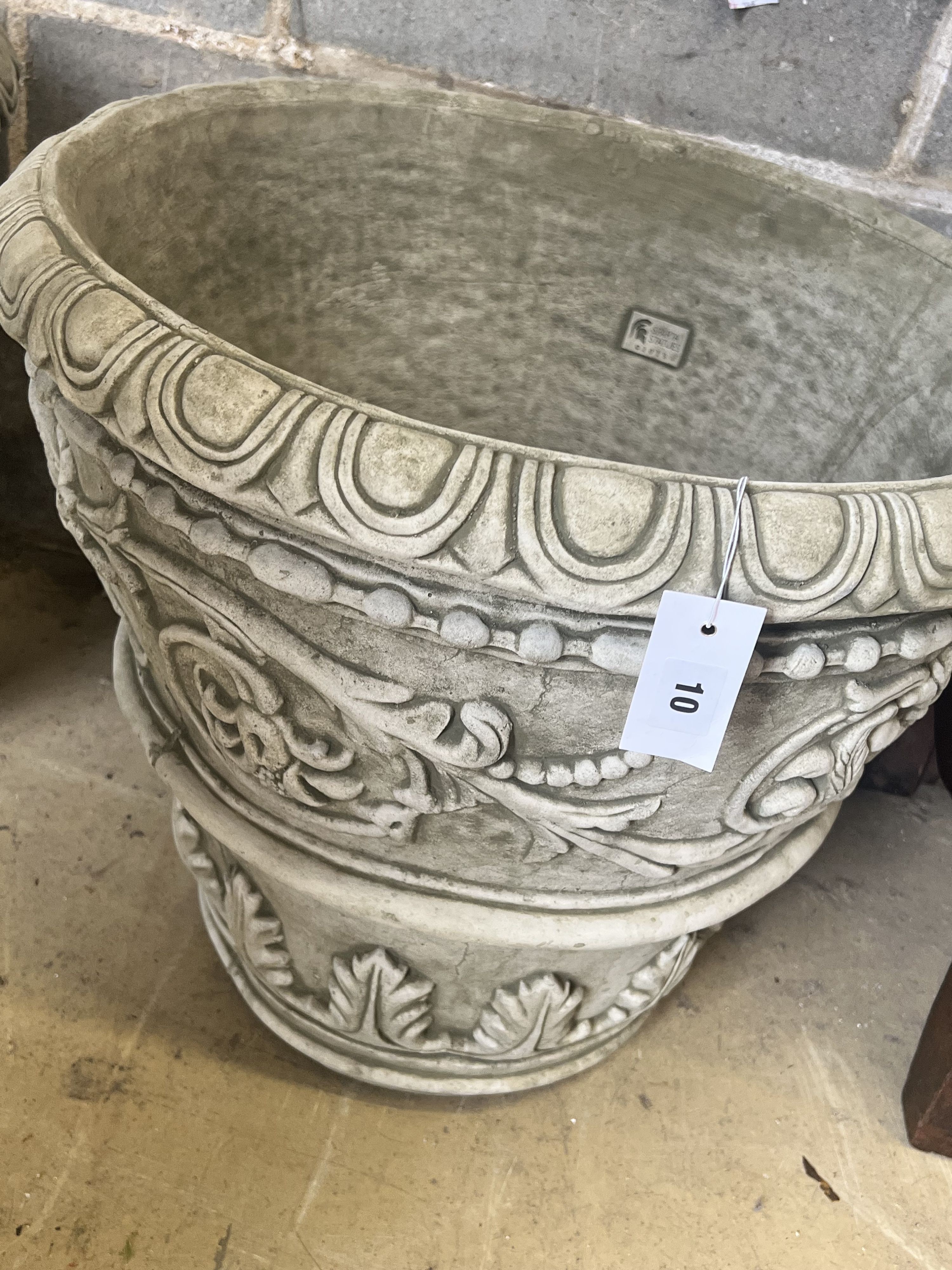 A pair of large reconstituted stone circular garden planters, diameter 55cm height 49cm